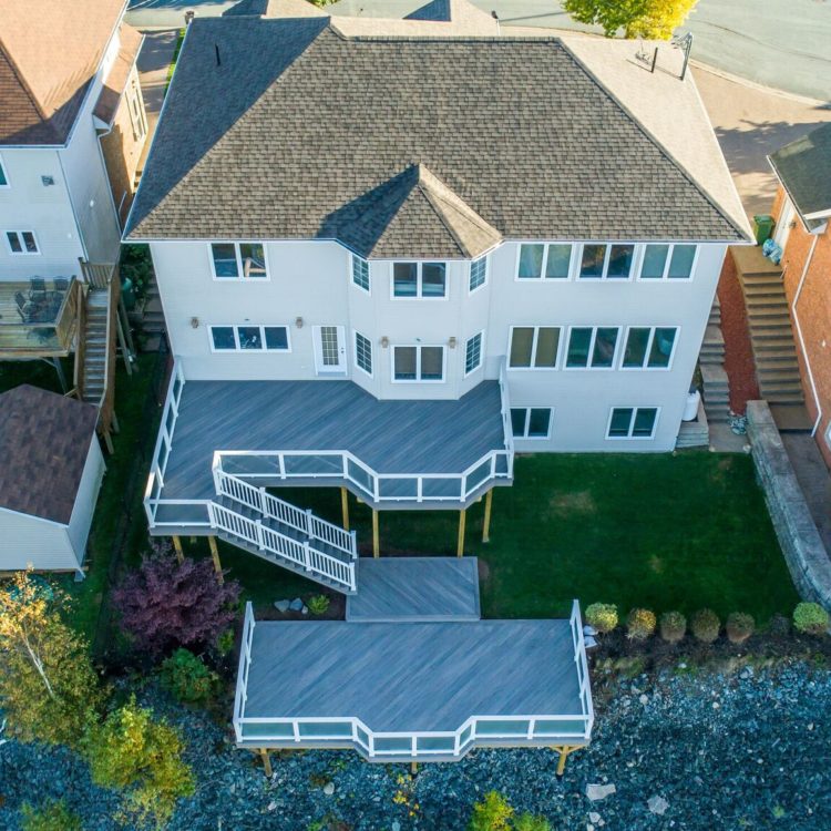 two-level custom composite deck with glass railings