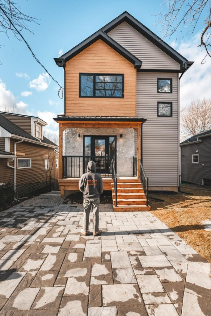 All-Craft craftsman standing in front of newly renovated Halifax home