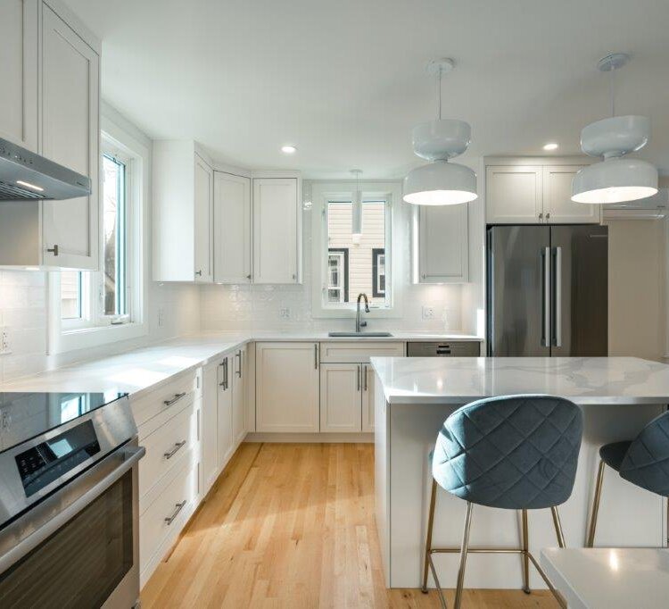 kitchen renovation with new kitchen island, quartz countertop, and hardwood floor