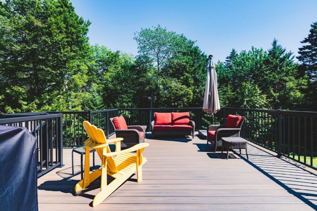 composite deck construction by All-Craft furnished with patio furniture