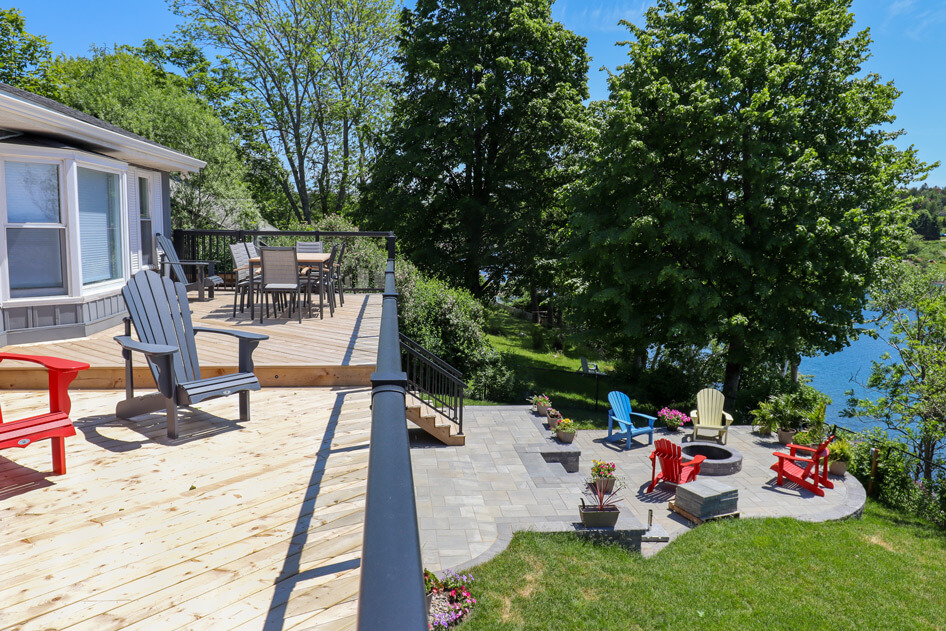 outdoor living renovation project with firepit and hardscaping